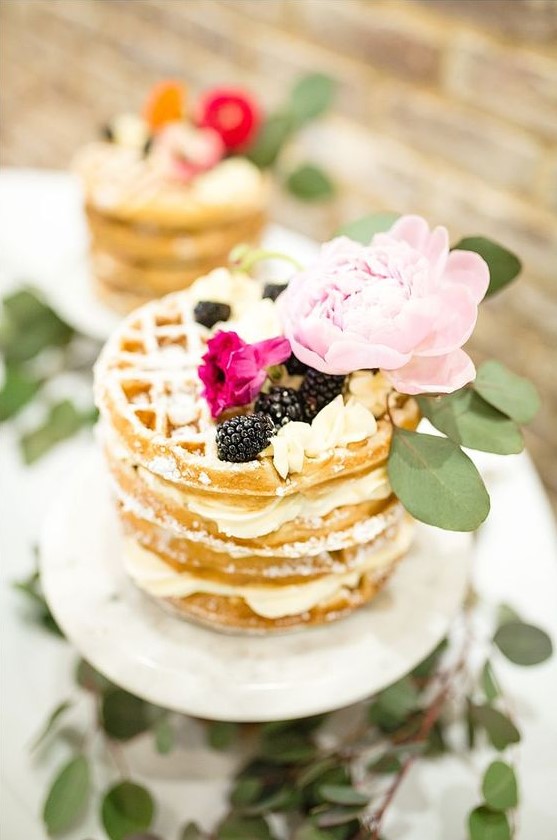 a delicious waffle wedding cake with blackberries, cream and a large pink peony on top for a summer wedding