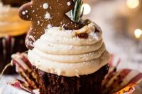 gingerbread cupcakes with creamy mascarpone frosting, rosemary and a gingerbread man on top