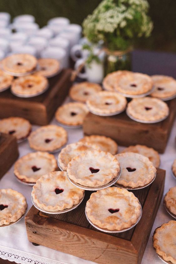 mini berry pies with hearts on top are adorable for a wedding, they taste good and look cute