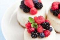 mini cheesecakes with fresh blackberries, raspberries and blueberries plus mint on top for a summer wedding