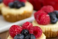 mini cheesecakes with fresh raspberries and blueberries are great for a modern wedding