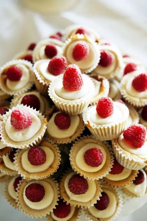 mini raspberry cheesecakes with fresh berries on top are super cool and look super cute