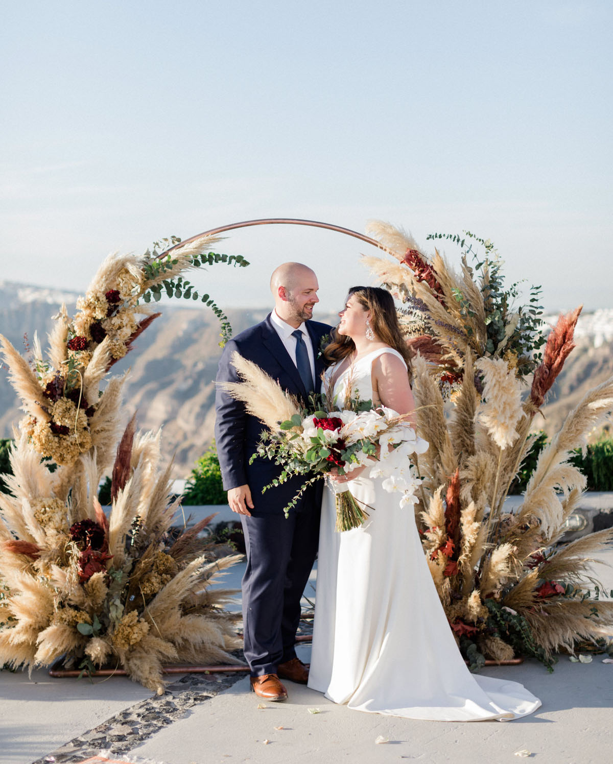 This beautiful Santorini wedding was filled with pampas grass, greenery and elegance