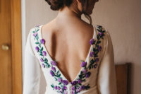 02 Her dress was featuring purple and lilac embroidered flowers and leaves, a cutout back on buttons and a long train