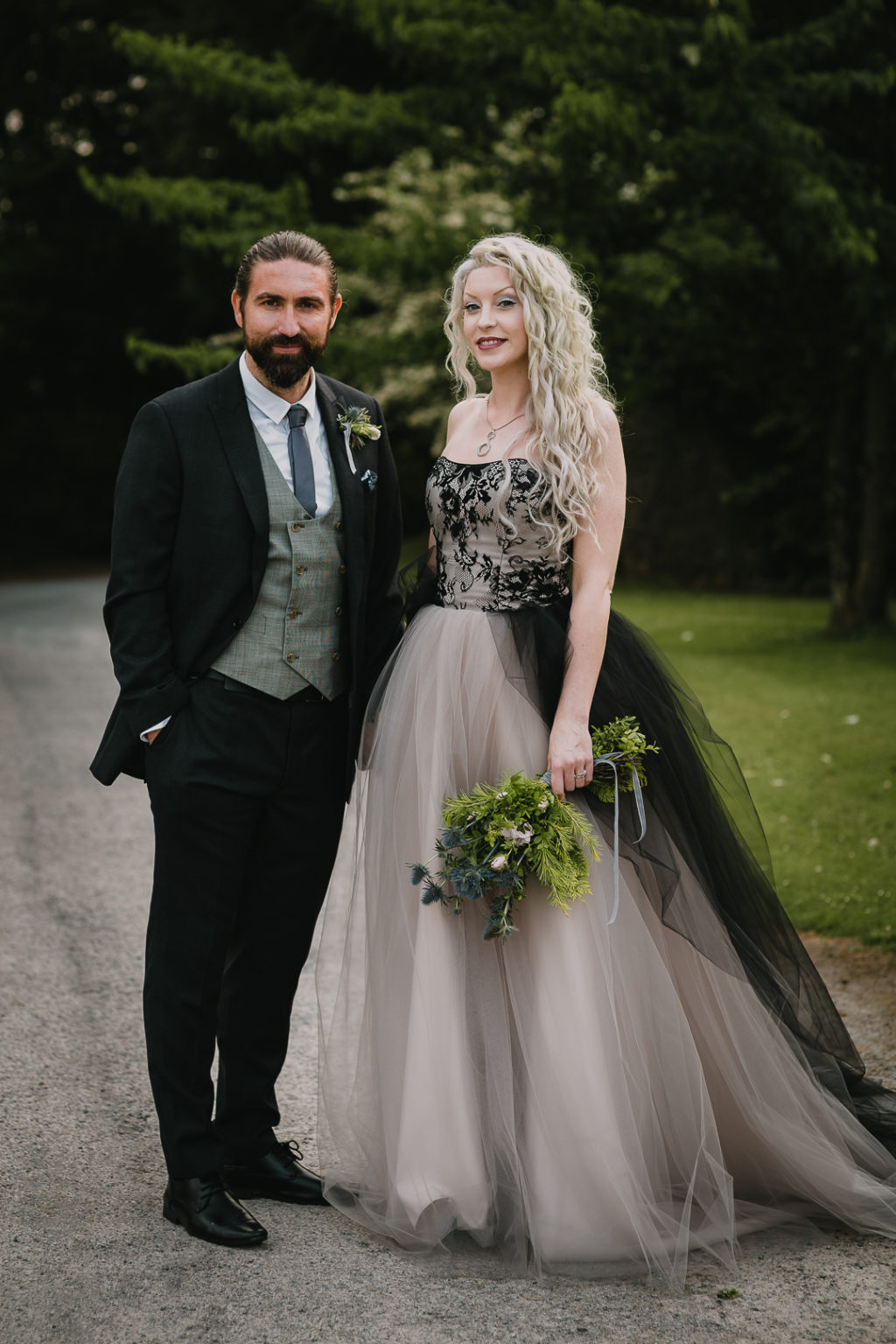 The bride was wearing a fantastic strapless A line black and white wedding dress with a lace bodice, and the groom was wearing a black suit, a grey waistcoat and a grey tie