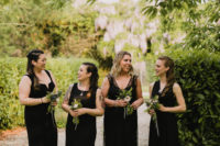 03 The bridesmaids were wearing mismatching black maxi dresses to match the gorgeous wedding gown