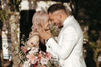 04 The bride was rocking pastel pink hair and was carrying a gorgeous pink and blush bouquet with greenery