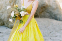 04 a fashion-forward wedding ensemble with a mustard crop top and a sunny yellow full skirt with pleating