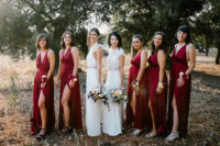 05 The bridesmaids were wearing burgundy maxi dresses with slits and floral corsages