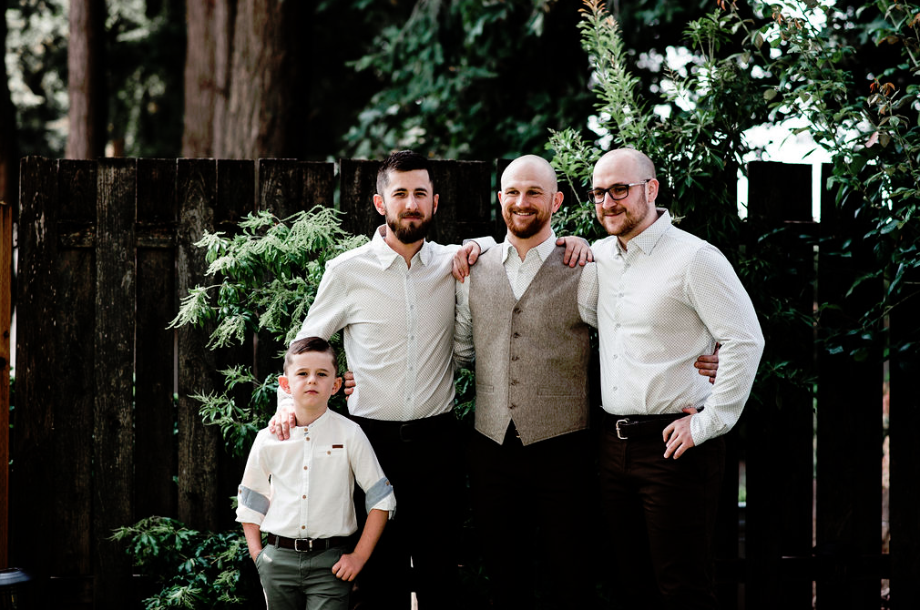 The groom was wearing brown pants, a grey waistcoat, a printed shirt and the groomsmen were rocking the same except for a waistcoat