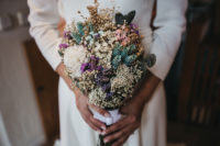 05 The wedding bouquet consisted of dried blooms and greenery, herbs and foliage and a right amount of purple and lilac