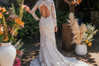 07 One of the wedding dresses was a fitting boho lace one with a cutout back and a train
