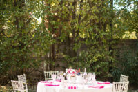 07 The table was set in creamy, hot pink and blush, with acrylic chairs to give it a more modern look