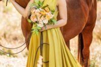 07 a mustard A-line wedding dress with a wide strap bodice, a pleated A-line skirt with a train