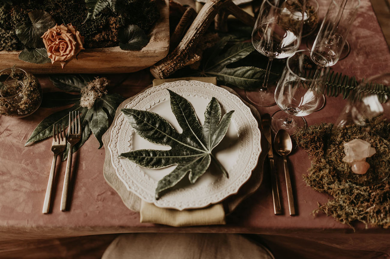The tablescape was done with greenery, dried looms and herbs, moss, neutrla napkins and simple cutlery