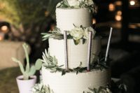 09 The wedding cake was a buttercream one, with lush greenery and white blooms