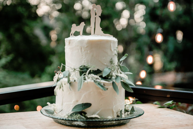The wedding cake was a white buttercream one, with greenery and cutout toppers