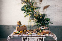 10 The table was decorated with macrame and there is a gorgeous lush greenery and dried flowers backdrop