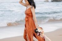 13 a paprika colored wedding dress with a wrapped and tied up bodice, spaghetti straps and slits for a fall beach bride