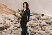 16 a teal velvet mermaid dress with long sleeves, a V-neckline and a train is a statement idea for a fall or moody bride