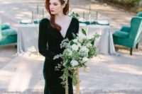 19 a beautiful forest green velvet wedding dress with a deep neckline, long sleeves and a train looks super exquisite
