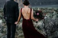 21 a burgundy velvet wedding dress with a train and a cutout back plus thin straps, a back necklace for a statement