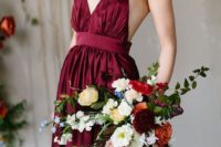 24 a burgundy wedding dress with a strap bodice and a pleated skirt plus an open back for a bold fall look