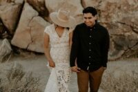 a boho groom’s look with a black shirt, rust-colored pants and brown shoes is a good idea for a boho or desert wedding