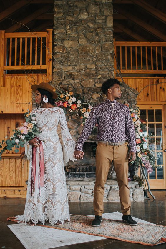a bright boho groom's look with a printed purple shirt, tan pants, navy shoes and a bolo tie is a cool and catchy idea