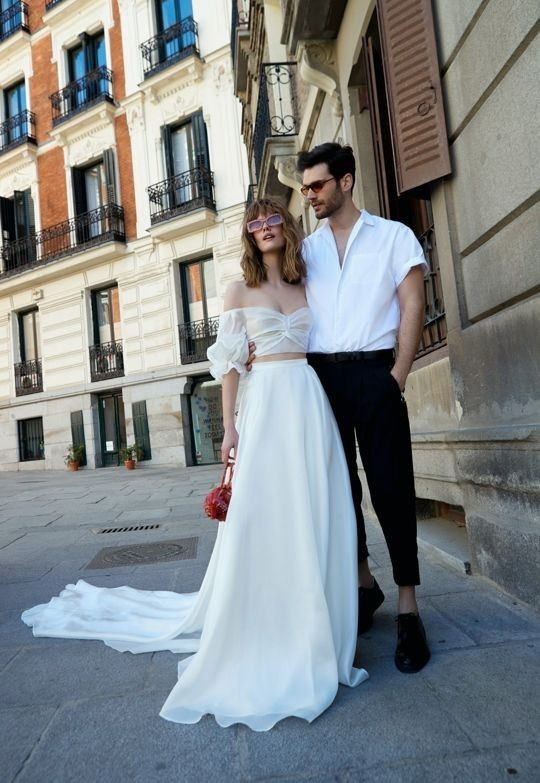 A super easy hot day groom's look with a short sleeve shirt, cropped black pants, shoes and sunglasses is a cool idea