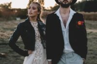 a white shirt, grey plaid pants, a brown velvet blazer and a matching hat for a bold and comfy winter boho wedding