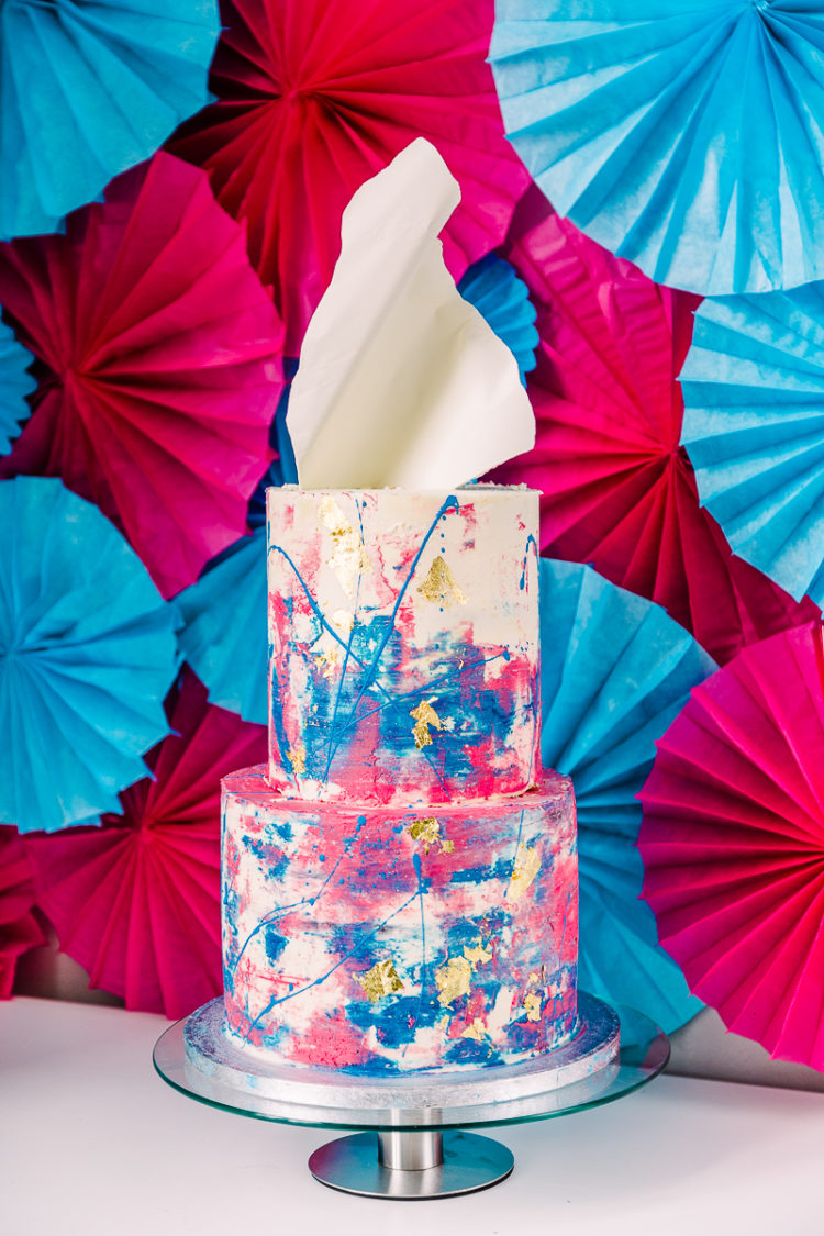Look at this fantastic wedding cake with pink and blue brushstrokes and splashes of paint