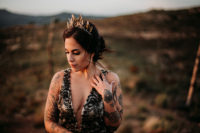 02 The bride was wearing a black lace wedding dress with thick straps, a covered plunging neckline and a gorgeous leafy headpiece