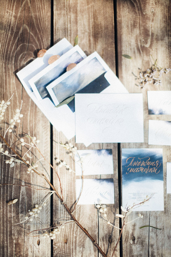 The wedding invitation suite was done with grey, blues and black and ombre touches