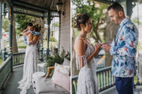 03 The bride was wearing a flroal lace wedding dress with a cold shoulder, a cutout back, a train, the groom was rocking navy pants, a navy tie, a floral jacket