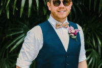 03 The groom was wearing navy pants, a waistcoat and a colorful bow tie