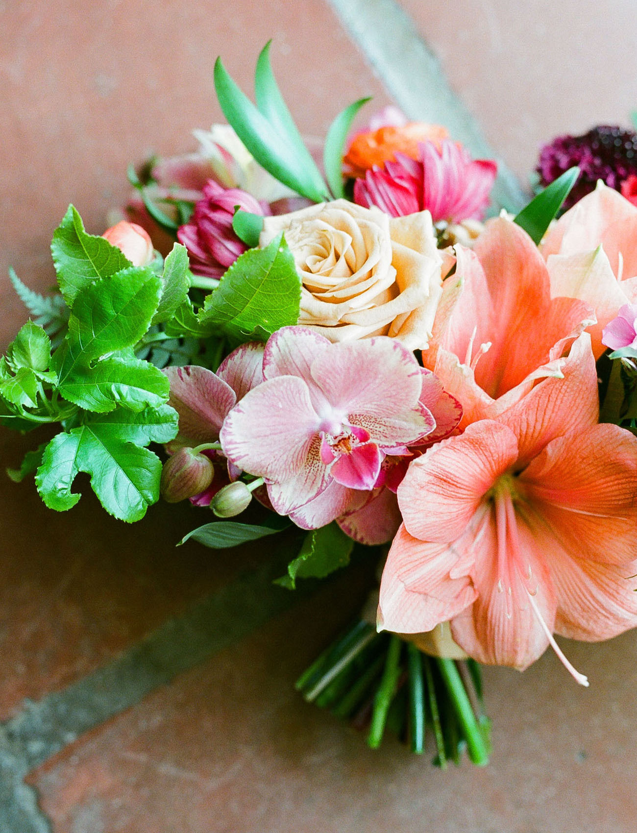 The wedding bouquet was done with hot pink and bright coral blooms and greenery