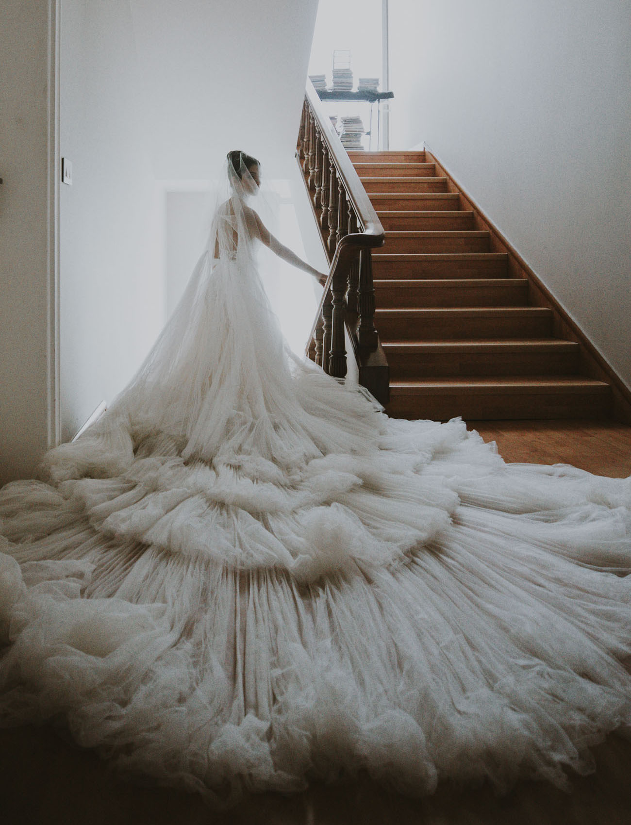 There was a super long train and a long veil that create a literal cloud around her