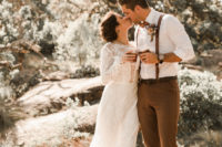 05 The groom was wearing brown pants, brown leather boots, a white shirt, an amber bow tie and suspenders