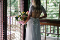 06 The wedding dress was with a lace bodice, a cutout back and a skirt with a train
