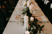 07 The tablescapes were done in neutrals, with fresh greenery and pillar candles to create a mood
