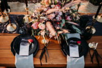 08 Black candles and chargers, a graphite runner, bold bloos and gilded touches made the wedding decor amazing