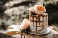 08 The first wedding cake was a naked one, with caramel drip and fresh blooms on top