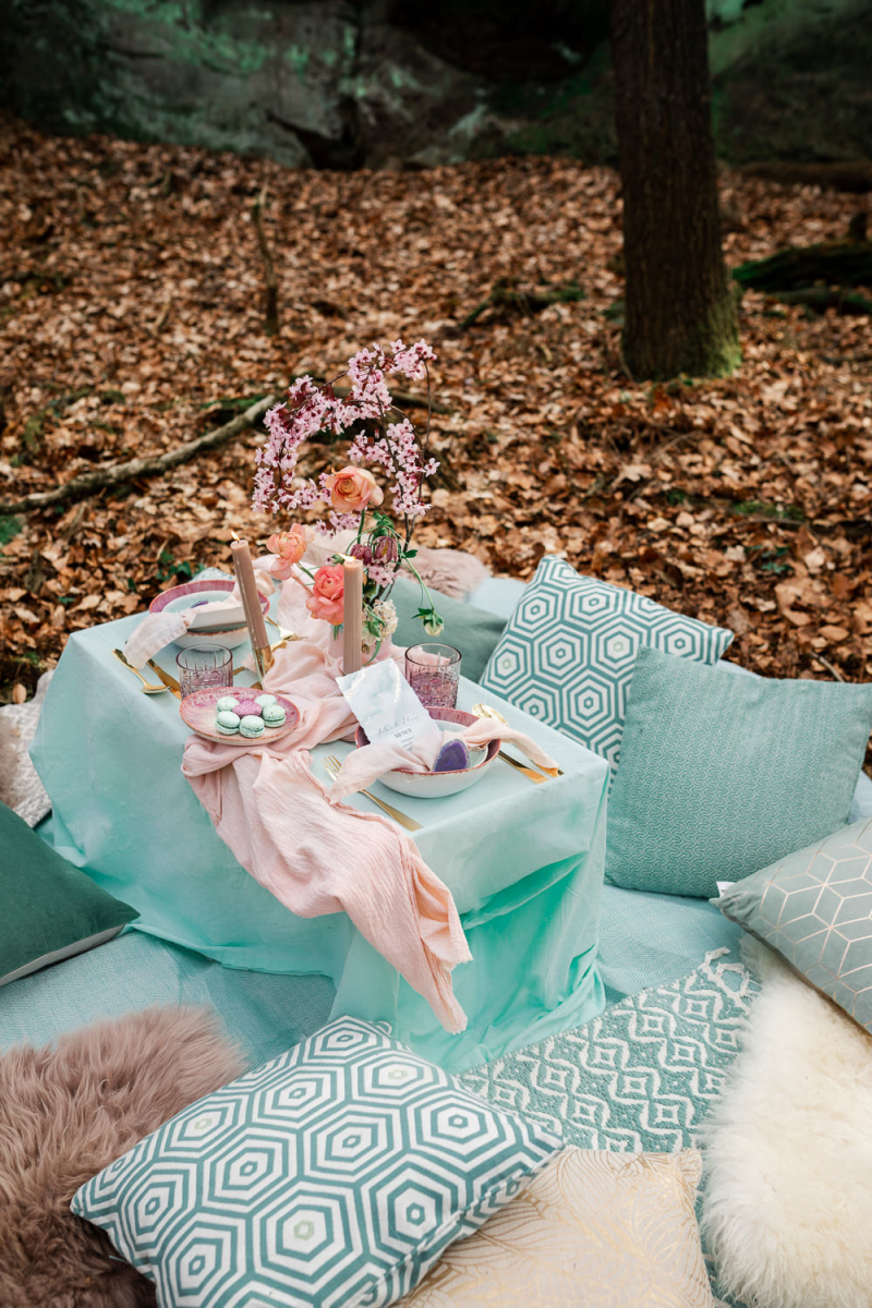 There was a picnic setting in pastels created for the couple, with lots of pillows, blooms and candles