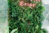 08 a lush greenery wall with a red neon sign is a very fresh and cool wedding decor idea