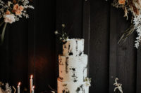 09 The wedding cake was white, with black brushstrokes and some dried blooms on top