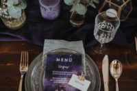 09 a decadent grey and purple wedding table setting with greenery, purple candles and menus and geometric touches