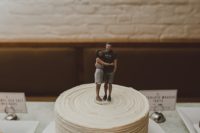 10 The wedding cake was casual and white, with the couple’s figurines on top – so cute