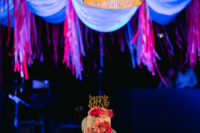10 The wedding cake was decorated with a veil, bright blooms and a gold topper