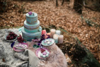 10 The wedding cake was done in purple and aqua, topped with macarons to match the color scheme